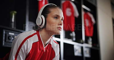 Buy stock photo Thinking, soccer and woman with headphones in locker room for music, audio and radio for training. Football, rest and person with track for exercise, fitness or workout for match, game and practice