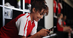 Locker room, watching and woman with smartphone, smile and browsing of video on social media and online. Happy, football player and person with mobile for streaming, healthy and girl with sportswear