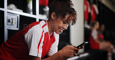 Buy stock photo Locker room, watching and woman with smartphone, smile and browsing of video on social media and online. Happy, football player and person with mobile for streaming, healthy and girl with sportswear