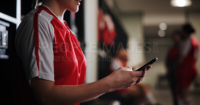 Buy stock photo Sports, soccer and woman with phone in locker room for social media, contact and communication. Athlete, football and hands of person on smartphone for match, training and tournament schedule