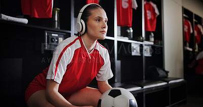 Buy stock photo Soccer, locker room and woman with ball and headphones for music, audio and radio for training. Football, rest and person listen to track for exercise, fitness or thinking for match, game or practice