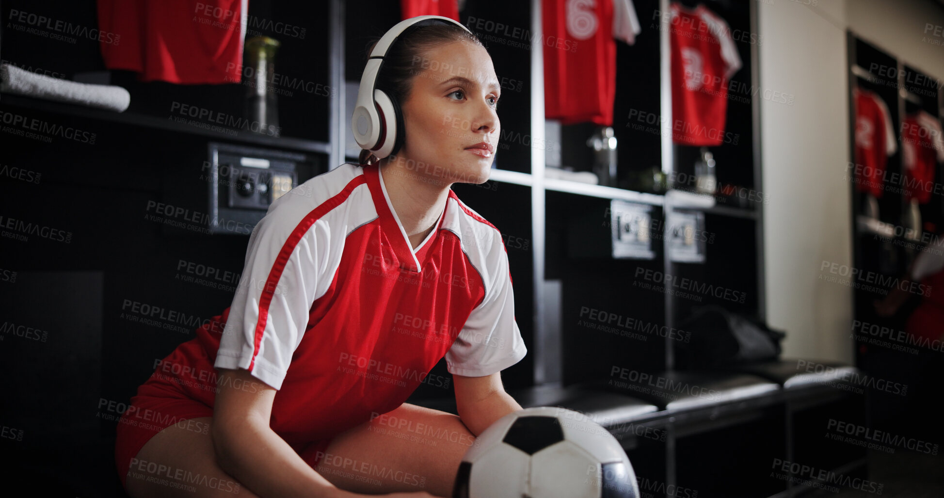 Buy stock photo Soccer, locker room and woman with ball and headphones for music, audio and radio for training. Football, rest and person listen to track for exercise, fitness or thinking for match, game or practice