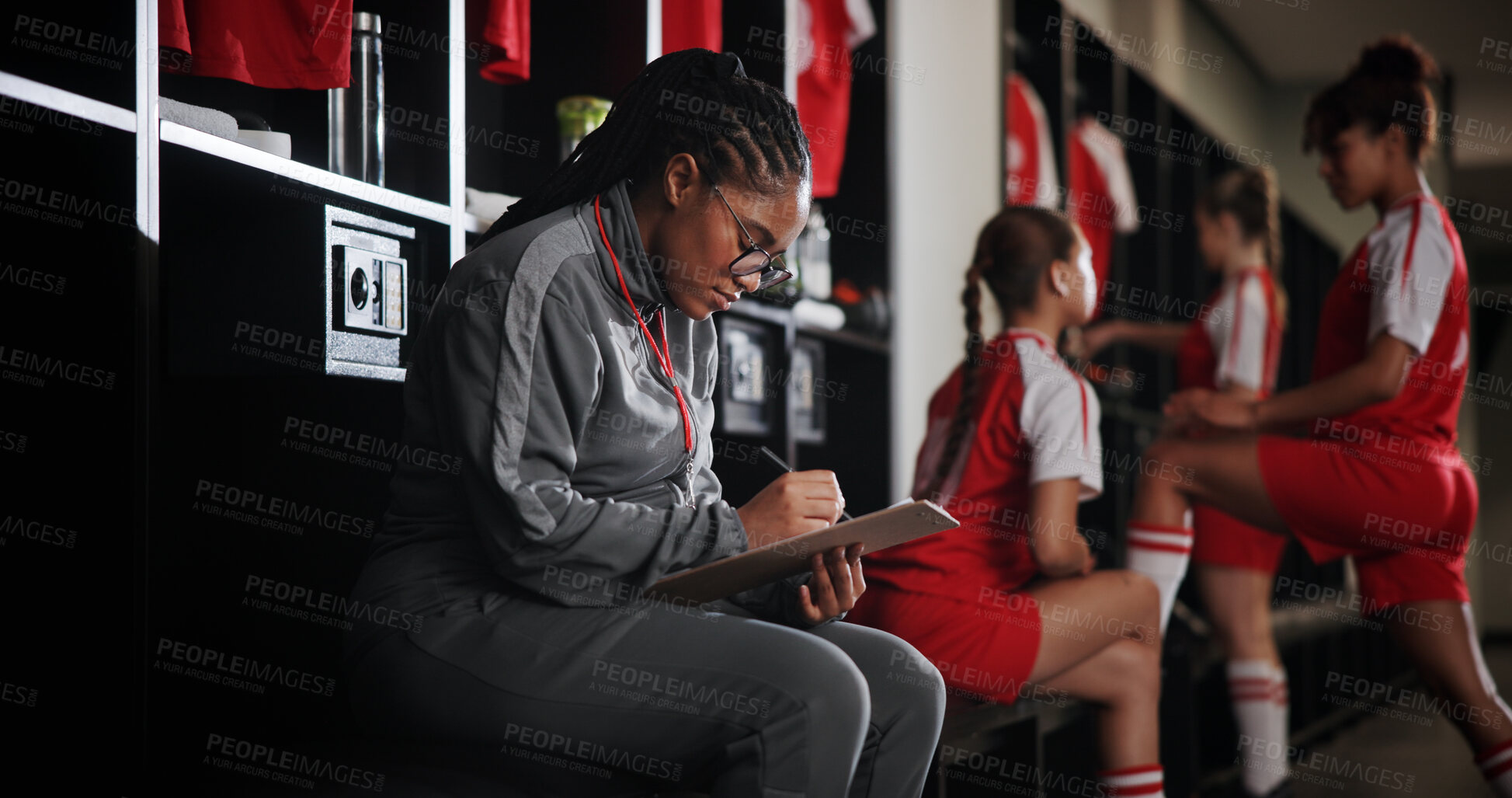 Buy stock photo Woman, soccer coach and writing with clipboard for checklist, game plan or attendance list in locker room. Female person, manager or coordinator with notes for match, sport or player registration