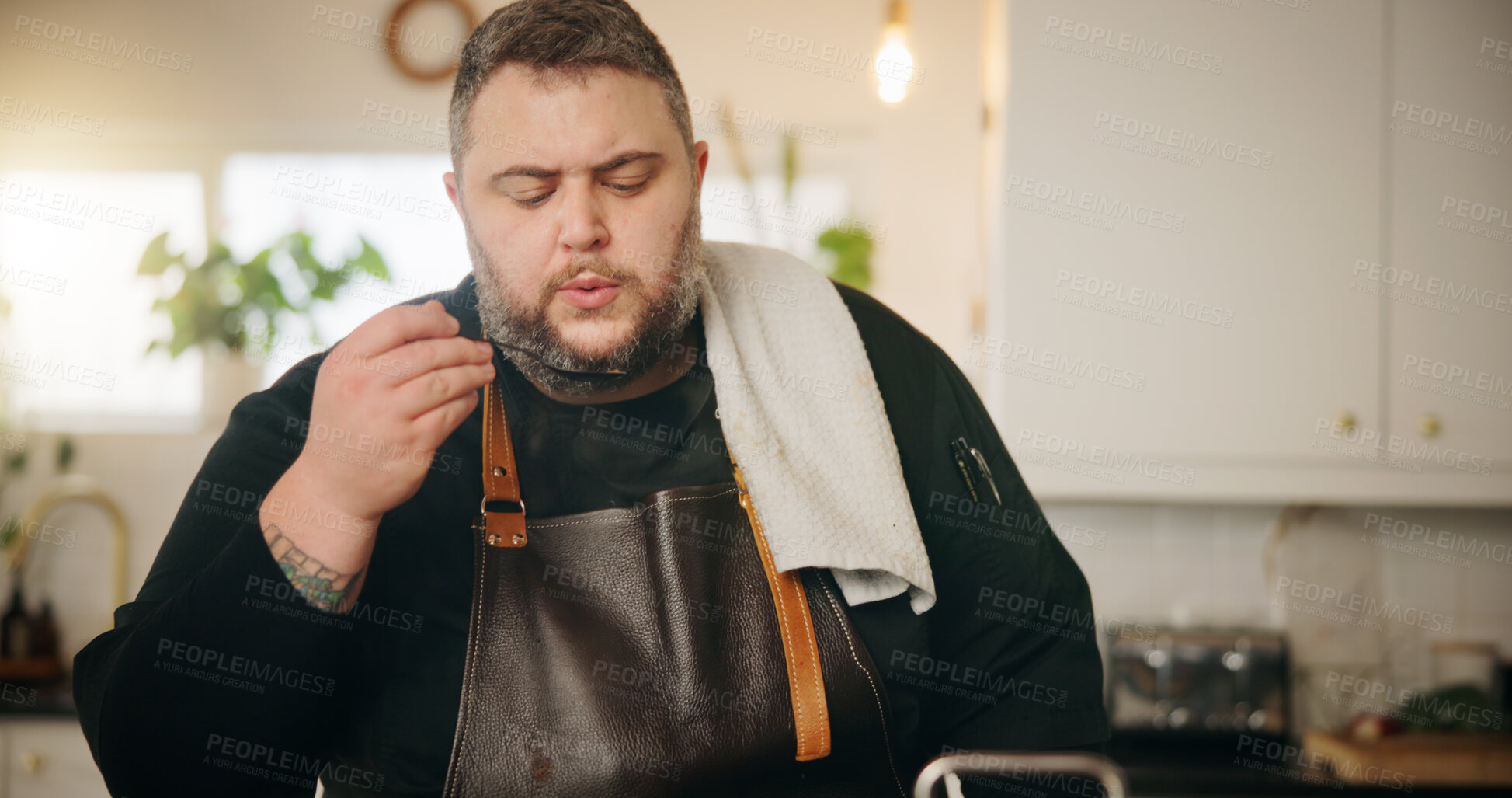 Buy stock photo Home, blow food and man in kitchen, chef and ingredients with apron, meal prep and cooking. Person, apartment and entrepreneur with flavour, taste test or lunch with recipe quality or culinary skills