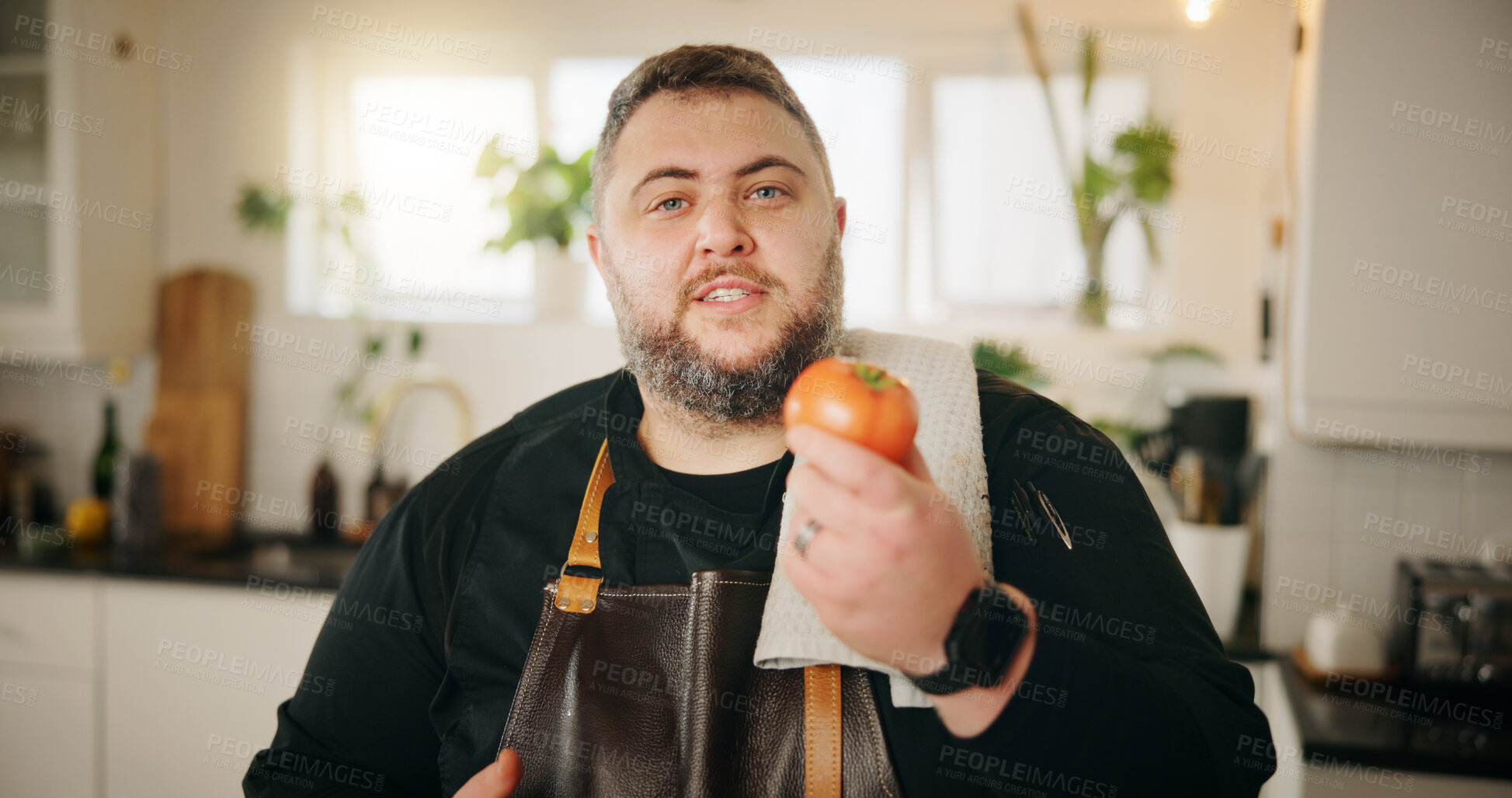 Buy stock photo Cooking, portrait and man in kitchen, tomato and influencer with instructions, ingredients and vegetables. Face, person or chef with recipe, home or live streaming with video broadcasting or tutorial