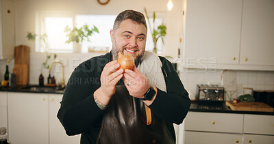 Buy stock photo Happy man, chef and cooking with onion in kitchen for main ingredient, flavor or starter at home. Portrait, male person or culinary artist with smile or vegetable for meal prep, antioxidant or recipe