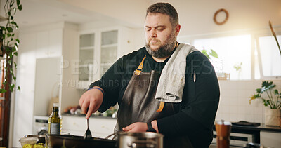 Buy stock photo Man, cooking and kitchen with stove for food, meal prep or hospitality service at home. Male person, culinary artist or chef with apron, recipe or mixing ingredients in pan for lunch with cuisine 