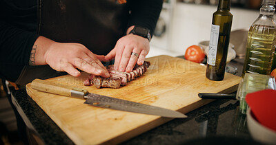 Buy stock photo Kitchen, hands and man with steak, cutting or culinary skills with food, wood board or healthy ingredients. Person, closeup or chef with meal prep meat or beef cuisine with knife, nutrition or home