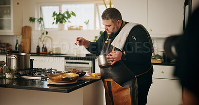 Buy stock photo Man, chef and cooking in kitchen with food, dinner or recipe online for content creation. Camera, recording and influencer person with equipment for live streaming, diet advice and meal in home
