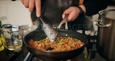Buy stock photo Person, hands and cooking with stove for food, meal prep or hospitality in kitchen at home. Closeup, culinary artist or mixing ingredients with pan for recipe, nutrition or dinner cuisine at house