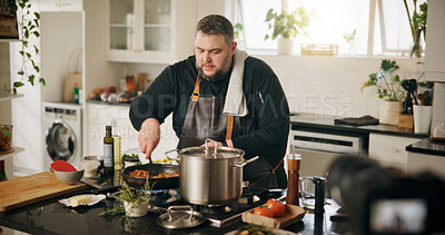 Buy stock photo Class, cooking and man with live streaming in kitchen for online tutorial, dinner meal and recipe recording. Culinary influencer, content creation and person with cuisine preparation and vlog in home