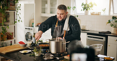 Buy stock photo Food, cooking and man with live streaming in home for gourmet recipe tutorial, meal prep and recording. Content creator, chef and filming video with dinner instructions and nutrition tips in kitchen