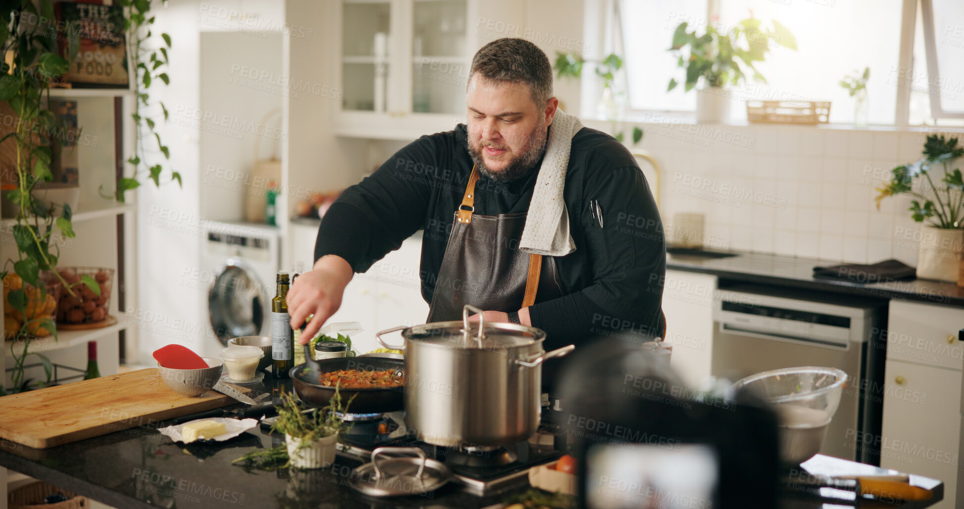 Buy stock photo Food, cooking and man with live streaming in home for gourmet recipe tutorial, meal prep and recording. Content creator, chef and filming video with dinner instructions and nutrition tips in kitchen