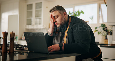Buy stock photo Man, chef and laptop with stress in kitchen for bad mistake, fatigue or burnout at home. Male person, culinary artist or tired cook with depression, ache or pain on computer for wrong recipe at house