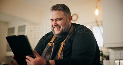 Buy stock photo Tablet, man and chef in kitchen for online recipe planning, instructions or research for cook book. Happy, digital technology and male person reading culinary review on restaurant business in home.