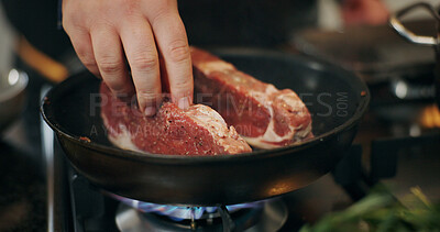 Buy stock photo Cooking, stove and hands of chef with steak in pan in kitchen for culinary skill, recipe and meal prep. Food, dinner and person with beef, protein and spice for gourmet dish, ingredients and cuisine