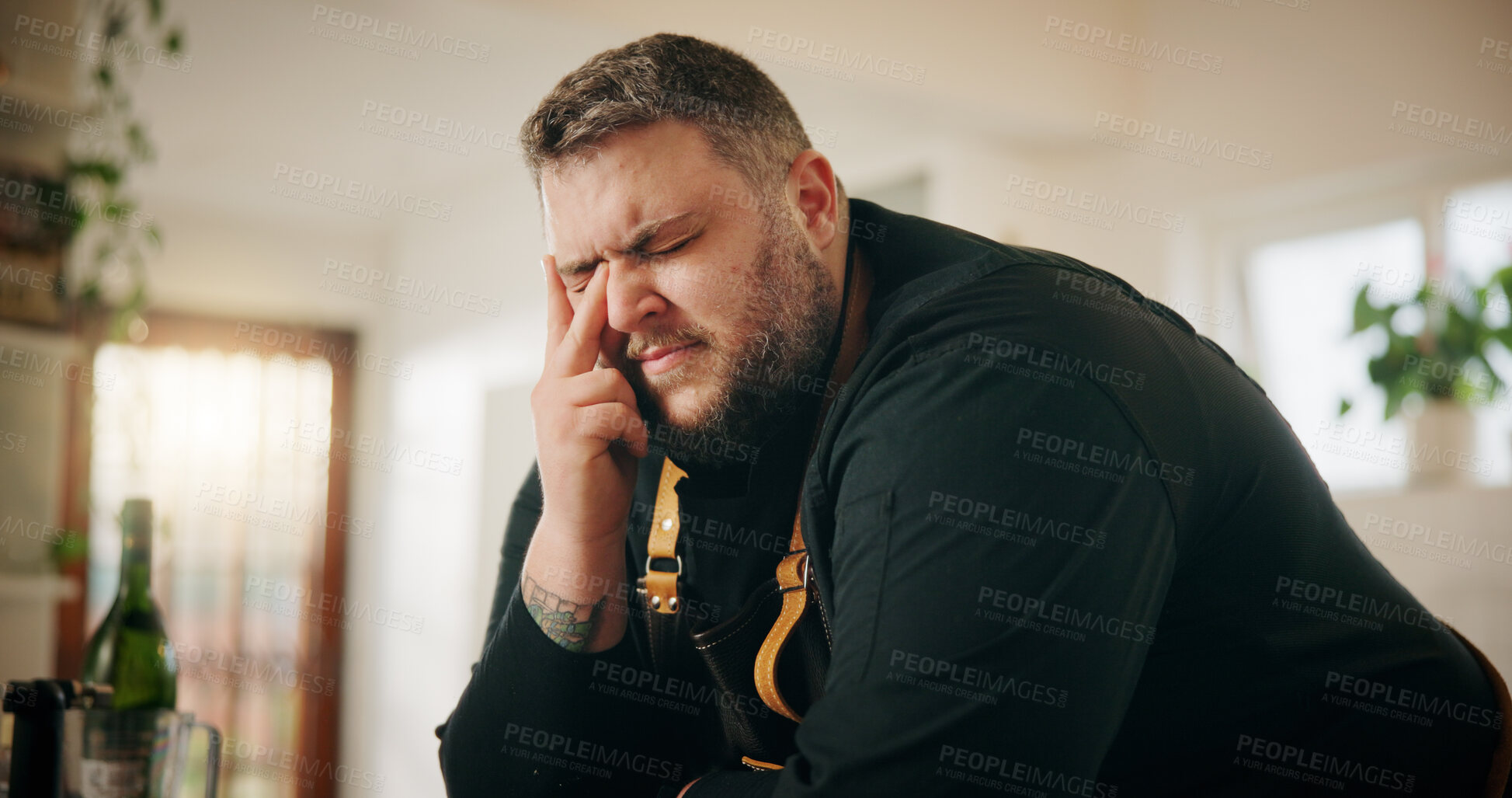 Buy stock photo Cooking, fatigue and stress with man in kitchen of home for crisis, failure or mistake. Frustration, headache and recipe disaster with chef in apartment for burnout, loss or small business startup