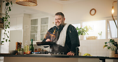 Buy stock photo Chef, cooking and man with pan, flame and smile for meal in kitchen, culinary skills and small business. Food industry, entrepreneur and person with recipe for cuisine, diner and preparation for dish