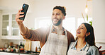 Happy couple, kitchen and cooking with selfie for photography, picture or memory together at home. Man, woman or lovers with smile for meal prep, social media or capture moment in apron at house