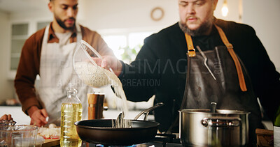 Buy stock photo Hands, chef and cooking lesson in home with pot, ingredients and teaching with nutrition in kitchen. People, mentor and learning with diet, meal prep and pour rice by stove for food at apartment