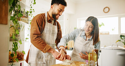 Buy stock photo Cooking, couple and help with meal prep in kitchen for teaching recipe, how to cut vegetables or support. Nutrition, happy people and talking in home with dinner guidance, instructions or food advice