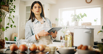 Buy stock photo Woman, tablet and thinking with kitchen, recipe and home for food ingredients and internet instructions. Technology, cooking or preparation with chef person in apartment for diet, health or nutrition