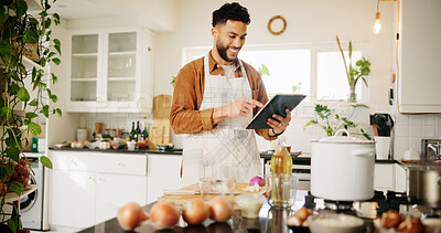 Buy stock photo Man, tablet and smile with kitchen, cooking and home with food ingredients and internet recipe instructions. Tech, blog and preparation with chef person in apartment for diet, health or nutrition