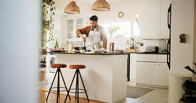 Buy stock photo Home, cook and man in kitchen for cooking, culinary skills and ingredients on counter for dinner. House, male person and chef with experience for food recipe, breakfast and meal prep on gas stove