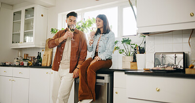 Buy stock photo Kitchen, couple and glasses of wine for celebration, smell and anniversary in healthy relationship. Home, man and woman with alcohol beverage for date, commitment and bonding with drink in marriage