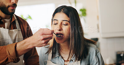 Buy stock photo Couple, cooking and taste with spoon in kitchen for meal, test and helping hand for recipe in home. People, man and woman with food, diet and nutrition with feeding, love and bonding at apartment