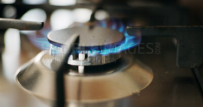 Buy stock photo Kitchen, gas stove and closeup with fire for cooking, meal prep and service in restaurant. Blue flame, appliance and machine with heat on cooktop for burner, energy and metal equipment with power