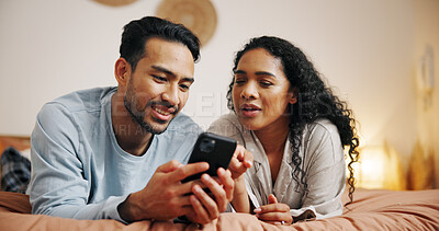Buy stock photo Couple, relax and browsing with phone on bed for social media, online streaming or entertainment at home. Man, woman or lovers lying in bedroom with mobile smartphone for network connection at house