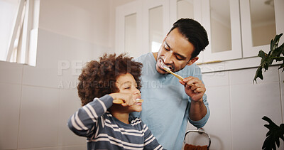 Buy stock photo Dental care, brushing teeth and father with child in bathroom for hygiene, wellness and morning routine. Teaching, family and dad with boy kid for oral health treatment with bonding in home.