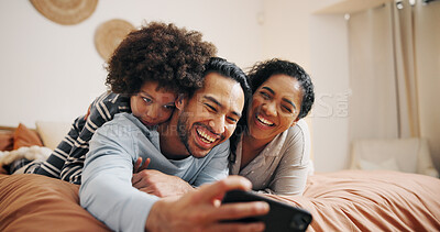 Buy stock photo Happy family, lying and selfie with picture on bed for photography or memory together at home. Mom, dad and child relax with smile in bedroom for capture moment, social media or online post at house