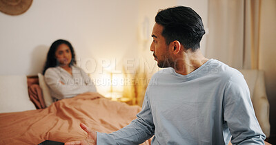 Buy stock photo Upset couple, bed and fight with argument for cheating affair, trust issues or disagreement at home. Frustrated, man or woman with dispute in bedroom for toxic relationship, conflict or divorce