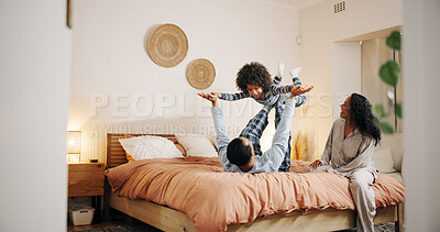 Buy stock photo Airplane, child and playing with dad, bedroom and bonding with parents in home, love and happiness. Family, together and fun with son in apartment, morning and balance of boy for games or flying