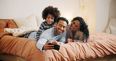 Buy stock photo Happy family, relax and selfie with picture on bed for photography or memory together at home. Mom, dad and child lying with smile in bedroom for capture moment, social media or online post at house