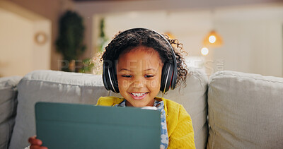Buy stock photo Tablet, headphones and happy child in home for online learning, music and play game for education. Girl, audio and kid with tech in living room for internet app, streaming cartoon and watch video