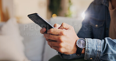 Buy stock photo Phone, hands and man on sofa in home for networking, social media or online communication. Closeup, cellphone and male person chatting on dating app for contact or connection in living room at house.