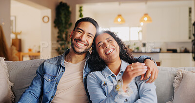 Buy stock photo Laugh, couple and hug in home for relax, love and bonding together on weekend. Portrait, happy man and woman in living room with funny joke for relationship, commitment and embrace partner for care