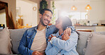 Laugh, couple and hug on sofa for love, relax and bonding together on weekend. Embrace, happy man and woman in home living room with funny joke for relationship, commitment and connection for support