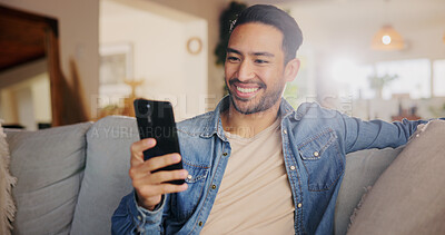 Buy stock photo Cellphone, relax and man on sofa in home for networking, social media or online communication. Happy, phone and male person chatting on dating app for contact or connection in living room at house.