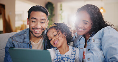 Buy stock photo Home, girl and parents on couch, tablet and child with social media, entertainment and smile. Family, apartment and mother with father, kid and technology with online video, funny or bonding together