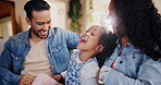 Parents, girl and tickle on sofa, happy and bonding with love, joke and relax in lounge at family house. People, mother and father with child, care and funny game with laughing in living room at home