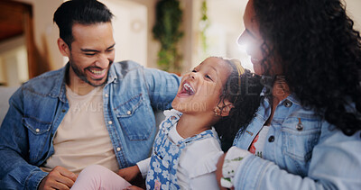 Buy stock photo Parents, girl and tickle on sofa, happy and bonding with love, joke and relax in lounge at family house. People, mother and father with child, care and funny game with laughing in living room at home