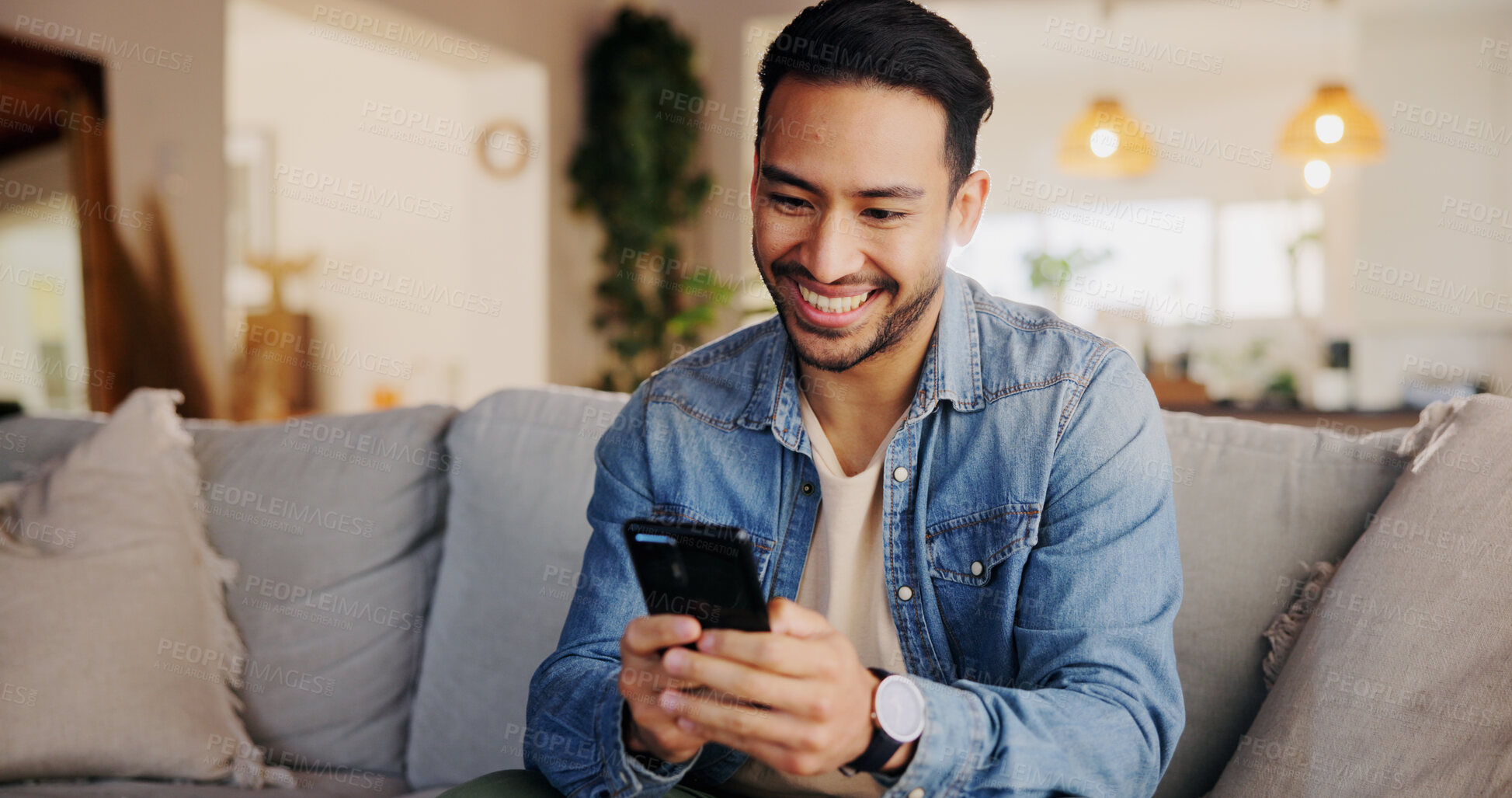 Buy stock photo Phone, happy and man on sofa in home for networking, social media or online communication. Relax, cellphone and male person chatting on dating app for contact or connection in living room at house.