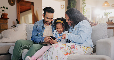 Buy stock photo Home, girl and parents on couch, cellphone and help with social media, online safety and laughing in lounge. Family, connection and mother with father, child or tech with funny video, app or guidance
