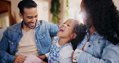 Buy stock photo Parents, girl and tickle on sofa, laugh and bonding with love, comic joke and relax in lounge at family house. People, mother and father with child, care and funny games in living room at apartment