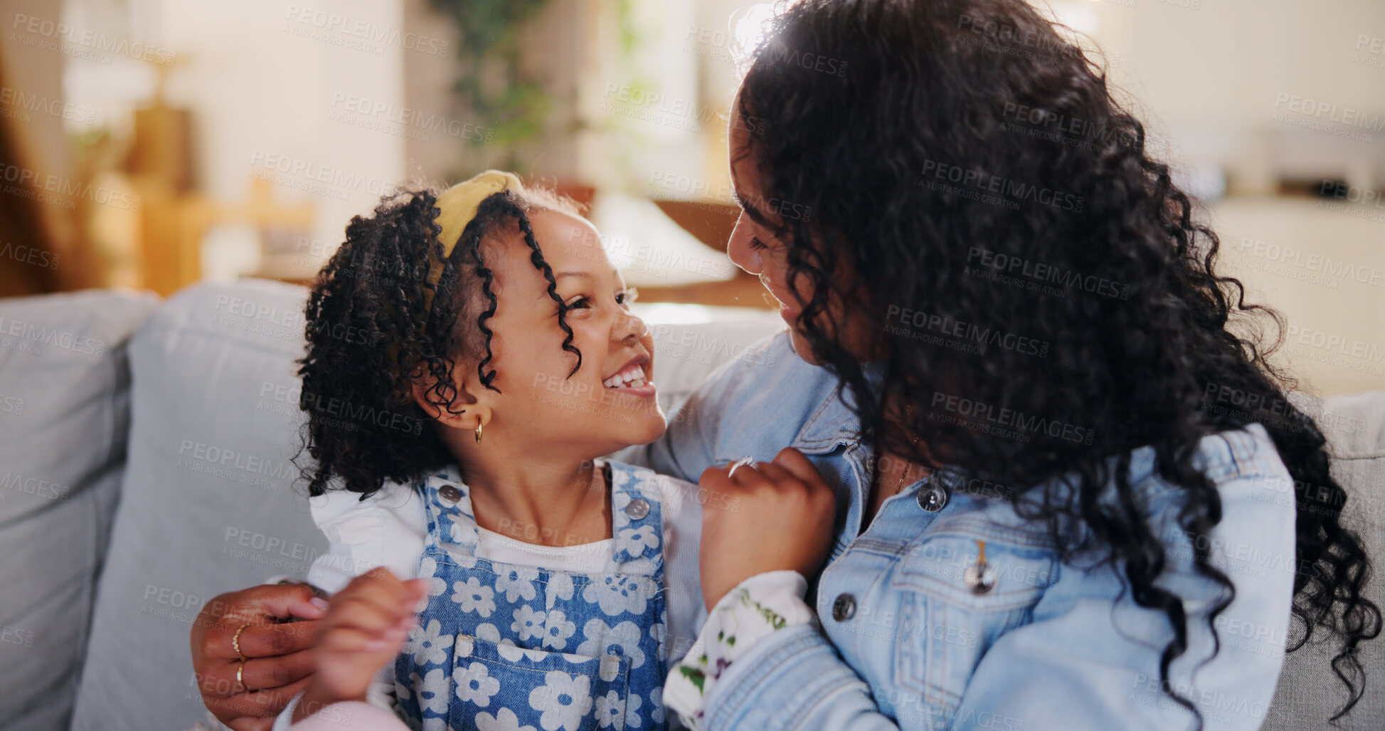 Buy stock photo Happy, hugging and mom with child on sofa for mothers day, bonding or family connection in home. Smile, sweet and woman embracing girl kid for care, trust or safety in living room in house together.