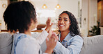 Games, mother and girl with hands together, smile and playing with fun, funny and bonding in lounge. Family, home and parent on couch, mama and daughter with motor skills, excited and happy with love